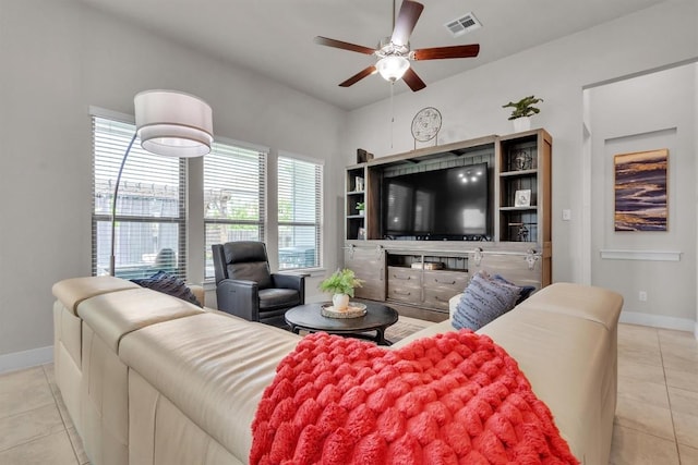 321 Millard St, Georgetown, TX 78628 - tiled living area with a ceiling fan and baseboards