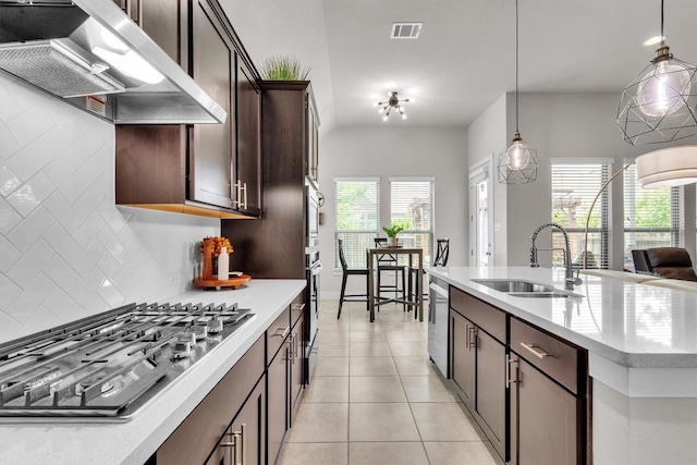 321 Millard St, Georgetown, TX 78628 - kitchen with ventilation hood, appliances with stainless steel finishes, plenty of natural light, and tasteful backsplash