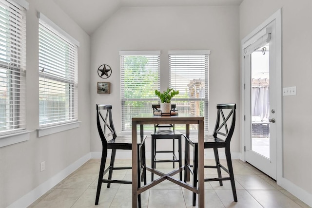 321 Millard St, Georgetown, TX 78628 - dining area featuring healthy amount of natural light, light tile patterned flooring, and vaulted ceiling