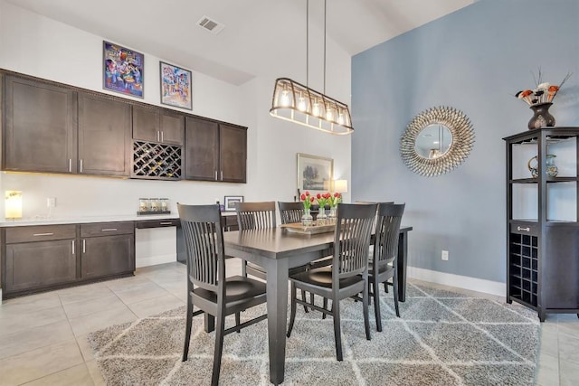 321 Millard St, Georgetown, TX 78628 - dining area with light tile patterned flooring and bar