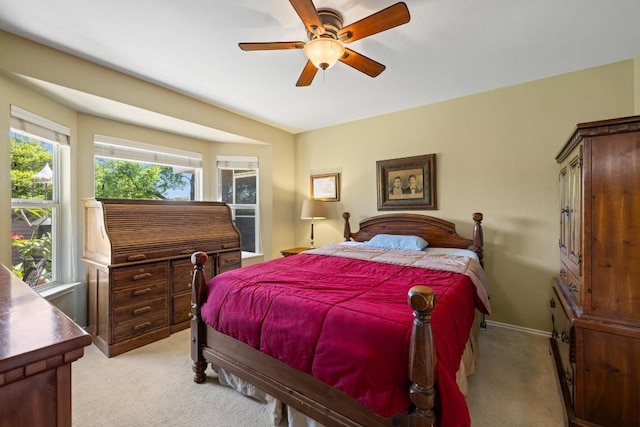 106 Whitewing Way, Georgetown, TX 78633 - bedroom with light carpet, baseboards, and a ceiling fan