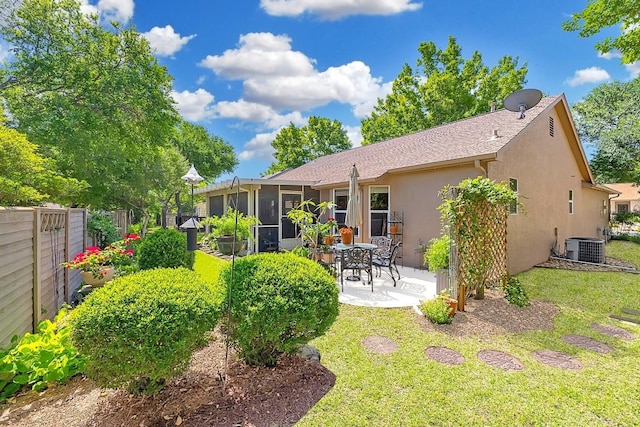 106 Whitewing Way, Georgetown, TX 78633 - back of property with stucco siding, central AC, a patio, and a sunroom