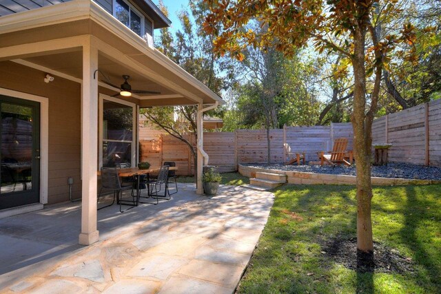 10312 Laredo Dr Unit 165, Austin, TX 78748 - fenced backyard with a patio area, ceiling fan, and outdoor dining space