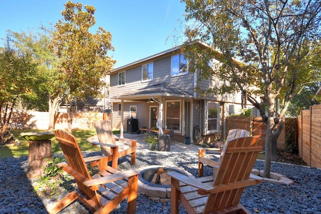 10312 Laredo Dr Unit 165, Austin, TX 78748 - rear view of property featuring an outdoor fire pit, a patio area, and a fenced backyard