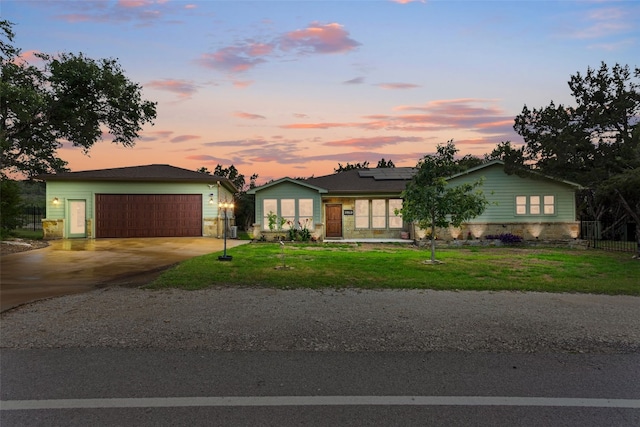 20603 Ridgeview Rd, Lago Vista, TX 78645 - ranch-style home featuring solar panels, a garage, a front yard, and concrete driveway