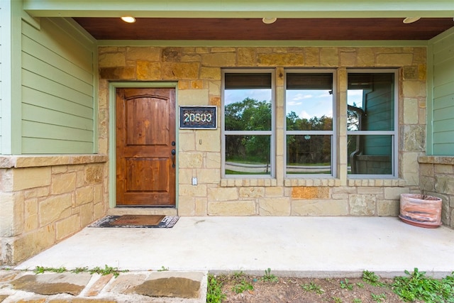 20603 Ridgeview Rd, Lago Vista, TX 78645 - doorway to property with stone siding