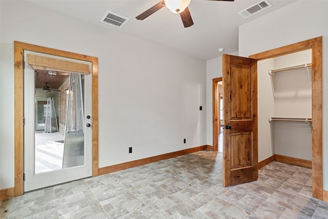 20603 Ridgeview Rd, Lago Vista, TX 78645 - unfurnished bedroom with stone finish floors and a ceiling fan