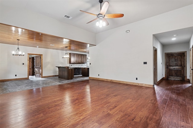 20603 Ridgeview Rd, Lago Vista, TX 78645 - unfurnished living room with a chandelier, ceiling fan, and dark wood-style floors