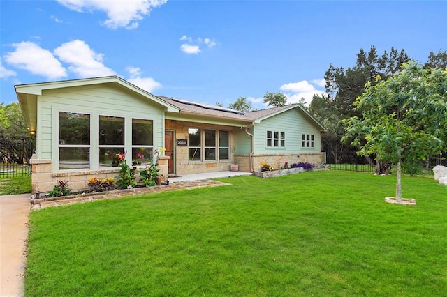 20603 Ridgeview Rd, Lago Vista, TX 78645 - rear view of house with stone siding and solar panels