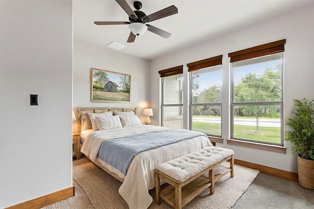 20603 Ridgeview Rd, Lago Vista, TX 78645 - bedroom with multiple windows, light carpet, and a ceiling fan