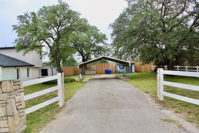 24701 Martin Ln, Spicewood, TX 78669 - view of front of property with a detached carport and driveway