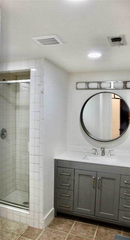 24701 Martin Ln, Spicewood, TX 78669 - full bathroom with vanity, a shower stall, and tile patterned flooring