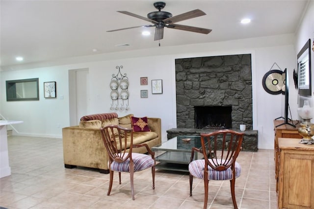 24701 Martin Ln, Spicewood, TX 78669 - living area featuring ceiling fan, a stone fireplace, light tile patterned floors, and recessed lighting