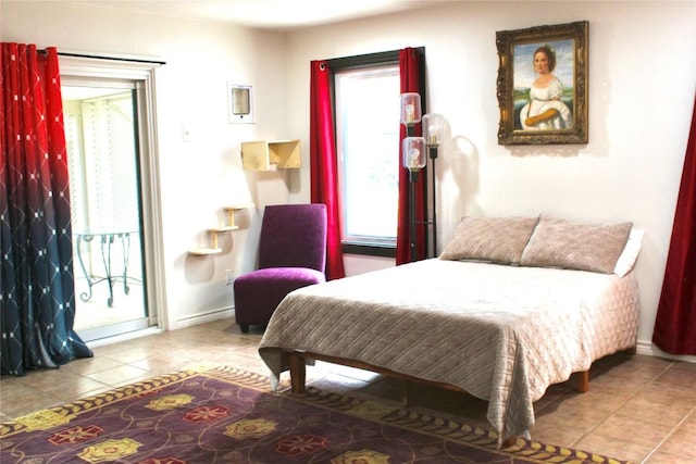 24701 Martin Ln, Spicewood, TX 78669 - tiled bedroom with baseboards