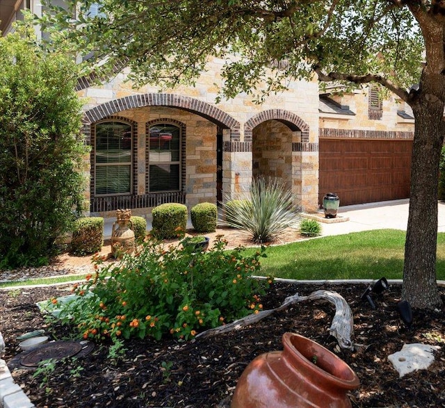 5517 Brady Bayou Cv, Austin, TX 78738 - view of yard featuring a garage and driveway