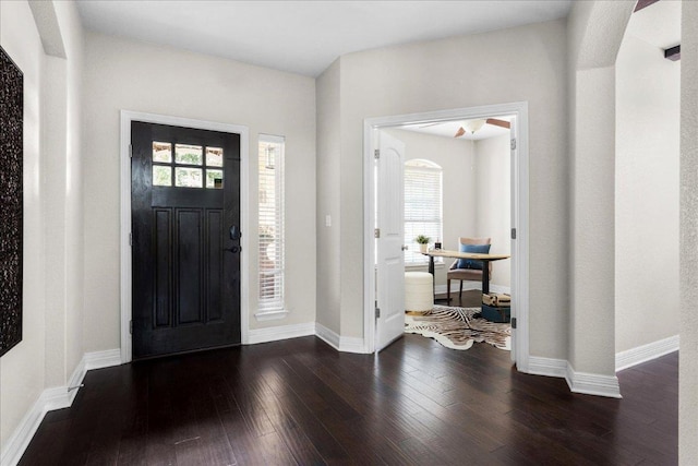 5517 Brady Bayou Cv, Austin, TX 78738 - foyer with dark wood-style flooring and arched walkways