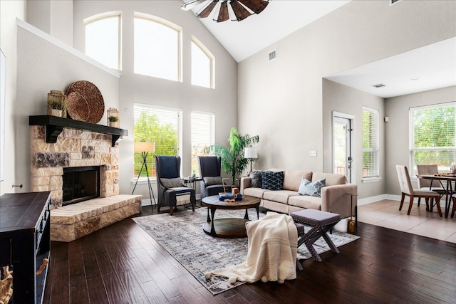 5517 Brady Bayou Cv, Austin, TX 78738 - living room featuring high vaulted ceiling, a stone fireplace, wood-type flooring, and ceiling fan