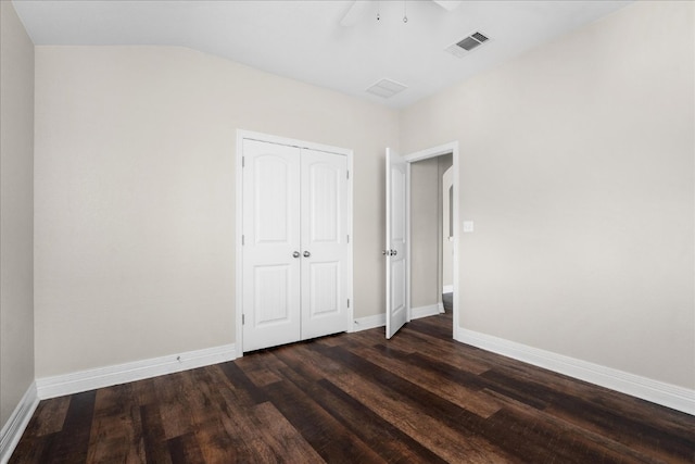 5517 Brady Bayou Cv, Austin, TX 78738 - unfurnished bedroom with dark wood finished floors, a closet, and a ceiling fan