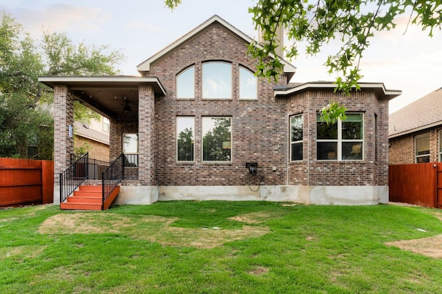 5517 Brady Bayou Cv, Austin, TX 78738 - rear view of house with brick siding and ceiling fan