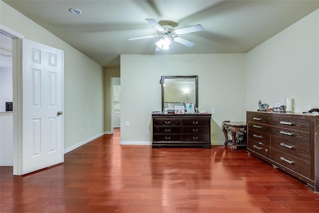 2718 Georgian Dr, Georgetown, TX 78626 - bedroom featuring dark wood-style floors, baseboards, and ceiling fan