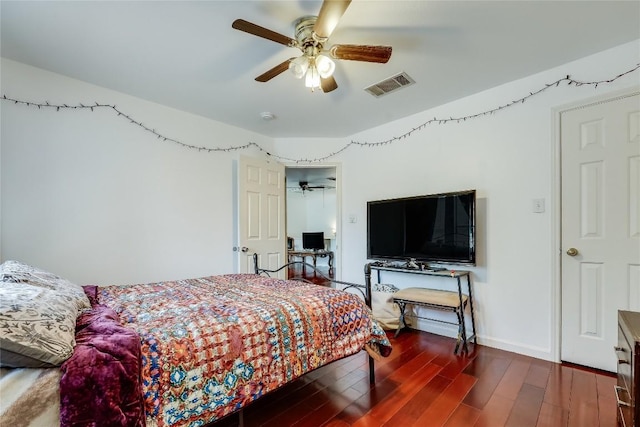 2718 Georgian Dr, Georgetown, TX 78626 - bedroom with wood finished floors, baseboards, and ceiling fan