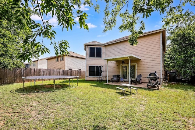 2718 Georgian Dr, Georgetown, TX 78626 - back of property featuring a trampoline, ceiling fan, and a patio area