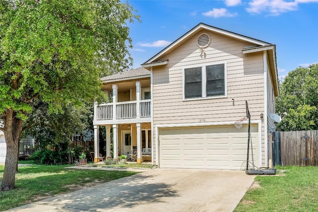 2718 Georgian Dr, Georgetown, TX 78626 - view of front facade with a garage, concrete driveway, and a balcony