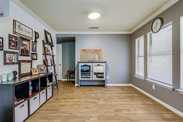 2718 Georgian Dr, Georgetown, TX 78626 - sitting room featuring ornamental molding, light wood-style floors, and baseboards