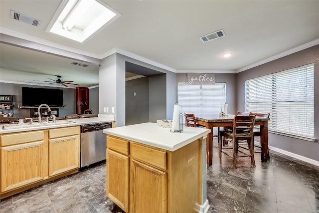 2718 Georgian Dr, Georgetown, TX 78626 - kitchen with dishwasher, a sink, crown molding, open floor plan, and baseboards