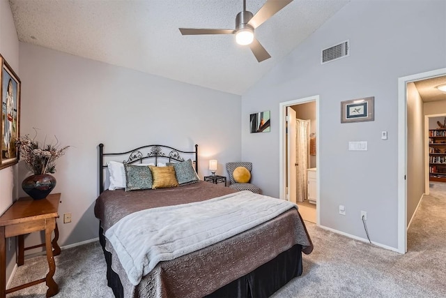 11901 Swearingen Dr Unit 30, Austin, TX 78758 - carpeted bedroom with ceiling fan, connected bathroom, and high vaulted ceiling
