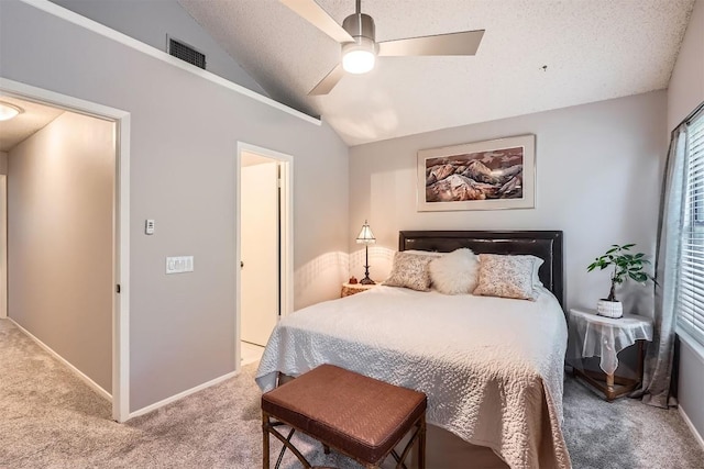 11901 Swearingen Dr Unit 30, Austin, TX 78758 - carpeted bedroom featuring lofted ceiling, ceiling fan, and a textured ceiling