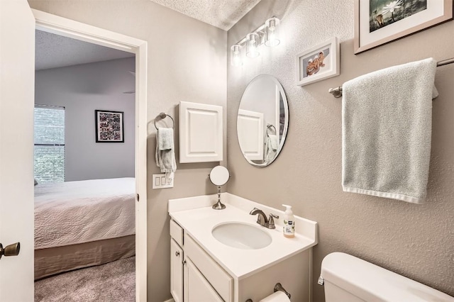 11901 Swearingen Dr Unit 30, Austin, TX 78758 - half bath with vanity, ensuite bathroom, and a textured ceiling