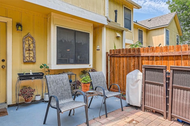 view of patio featuring fence