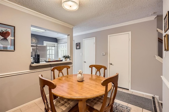 11901 Swearingen Dr Unit 30, Austin, TX 78758 - dining area featuring light tile patterned floors, ornamental molding, and a textured ceiling