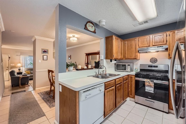 kitchen featuring stainless steel appliances, under cabinet range hood, a sink, light tile patterned floors, and light countertops