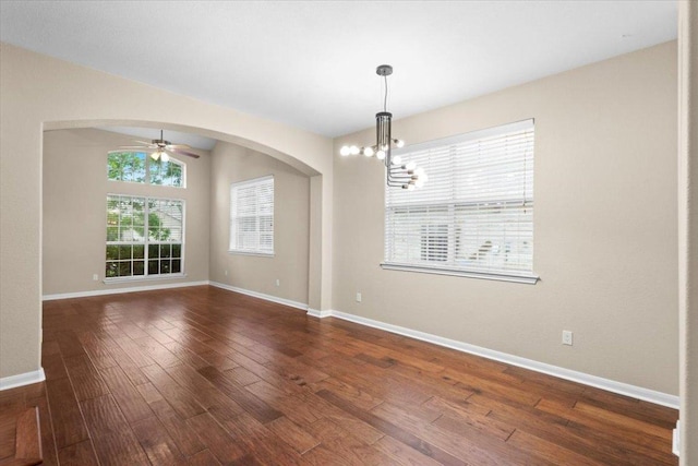 2502 Nightshade Dr, Cedar Park, TX 78613 - unfurnished room with a chandelier, wood finished floors, ceiling fan, and arched walkways