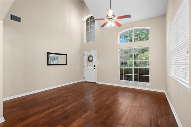 2502 Nightshade Dr, Cedar Park, TX 78613 - unfurnished living room featuring ceiling fan, dark wood-style flooring, plenty of natural light, high vaulted ceiling, and baseboards