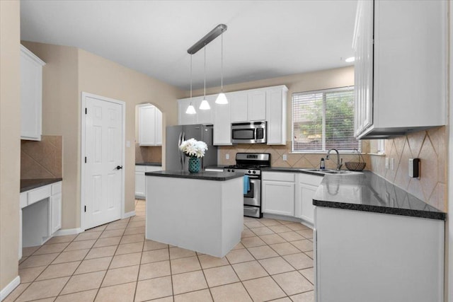 2502 Nightshade Dr, Cedar Park, TX 78613 - kitchen with appliances with stainless steel finishes, a sink, tasteful backsplash, dark countertops, and white cabinets