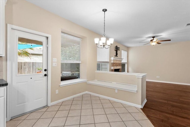 2502 Nightshade Dr, Cedar Park, TX 78613 - unfurnished dining area with ceiling fan, plenty of natural light, a chandelier, and baseboards