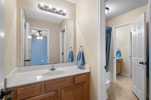 2502 Nightshade Dr, Cedar Park, TX 78613 - bathroom with vanity, toilet, a ceiling fan, and tile patterned flooring