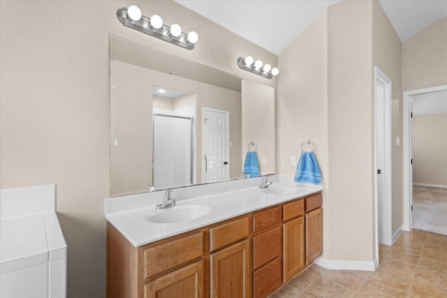 2502 Nightshade Dr, Cedar Park, TX 78613 - bathroom with double vanity, a stall shower, tile patterned floors, and baseboards