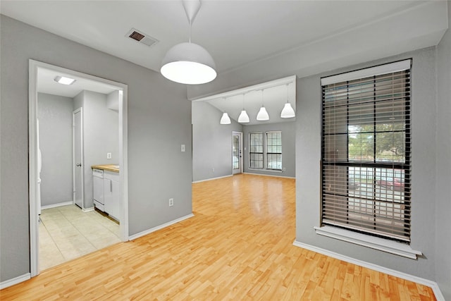 1202 Thorpe Ln Unit 508, San Marcos, TX 78666 - unfurnished dining area with wood finished floors and baseboards