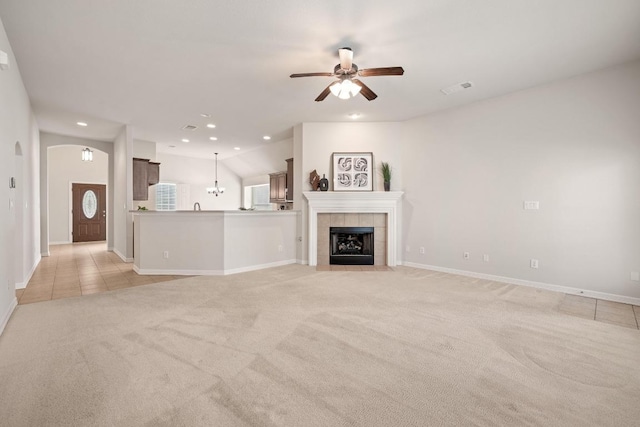765 Bent Wood Pl, Round Rock, TX 78665 - unfurnished living room featuring light colored carpet, recessed lighting, ceiling fan, a tile fireplace, and baseboards