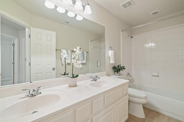 765 Bent Wood Pl, Round Rock, TX 78665 - bathroom featuring tile patterned flooring, toilet, double vanity, and washtub / shower combination