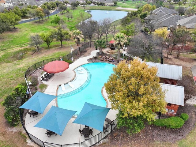 765 Bent Wood Pl, Round Rock, TX 78665 - community pool featuring fence, outdoor dining area, a water view, and a patio area