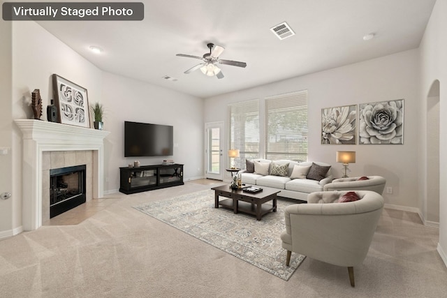 765 Bent Wood Pl, Round Rock, TX 78665 - living room with ceiling fan, carpet floors, baseboards, and a tile fireplace