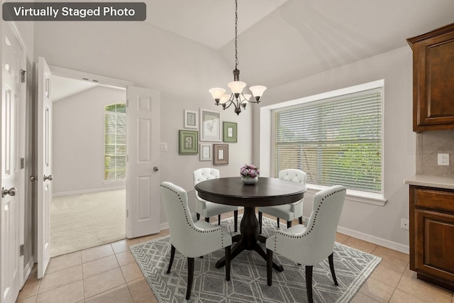 765 Bent Wood Pl, Round Rock, TX 78665 - dining area featuring a chandelier, light tile patterned floors, lofted ceiling, and baseboards