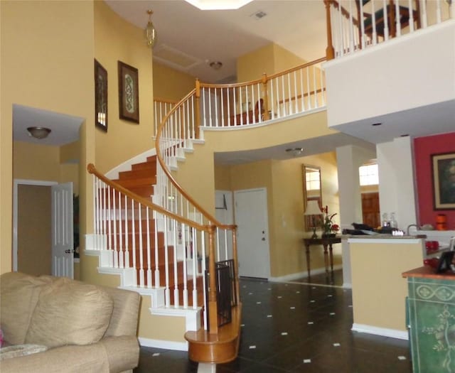 4003 Wyman Cv, Round Rock, TX 78681 - staircase featuring a high ceiling and baseboards