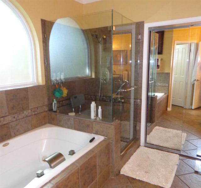 4003 Wyman Cv, Round Rock, TX 78681 - bathroom with a garden tub, a stall shower, and tile patterned flooring