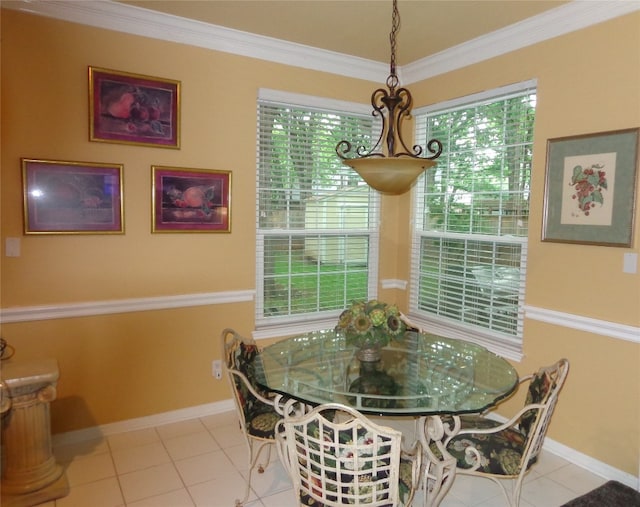 4003 Wyman Cv, Round Rock, TX 78681 - tiled dining space featuring crown molding and baseboards